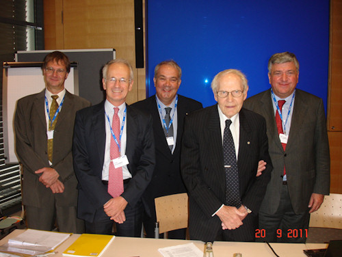 Photo 3 – 2011 TC10 Plenary Meeting. From left to right: A representative of WACKER SILICONES (Germany) that together with the German Committee hosted TC10 Meeting, Mr. Charles Jaquemart (IEC CO), Mr. Massimo Pompili (IEC TC10 Secretary), Mr. Ray Bartnikas (IEC TC10 Chairman), and Mr. Vander Tumiatti (IEC TC10 Assistant Secretary). Photo 3 – 2011 TC10 Plenary Meeting. From left to right: A representative of WACKER SILICONES (Germany) that together with the German Committee hosted TC10 Meeting, Mr. Charles Jaquemart (IEC CO), Mr. Massimo Pompili (IEC TC10 Secretary), Mr. Ray Bartnikas (IEC TC10 Chairman), and Mr. Vander Tumiatti (IEC TC10 Assistant Secretary).
